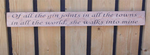 Wooden sign Of all the gin joints in al the towns in all the world she walks...