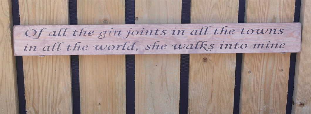 Wooden sign Of all the gin joints in al the towns in all the world she walks...
