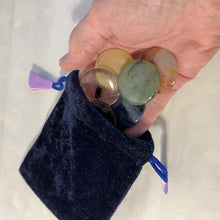 Load image into Gallery viewer, Set of 7 Chakra Discs supplied with a Velvet Bag | Discs include Clear Quartz, Amethyst, Sodalite, Green Aventurine, Yellow Onyx, Carnelian, and Red Jasper.
