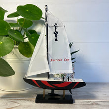 Load image into Gallery viewer, Americas Cup Model Yacht  - Black and Red hull | Sailing | Yacht | Boats | Models | Sailing Nautical Gift | Sailing Ornaments | Yacht on Stand | 23cm (H) x 16cm (L) x 3cm (W)
