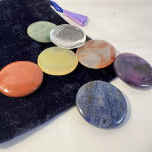 Set of 7 Chakra Discs supplied with a Velvet Bag | Discs include Clear Quartz, Amethyst, Sodalite, Green Aventurine, Yellow Onyx, Carnelian, and Red Jasper.