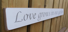 Load image into Gallery viewer, British handmade wooden sign Love grows in the garden