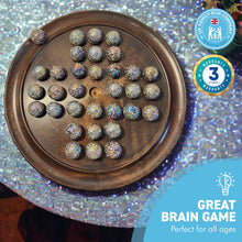 Load image into Gallery viewer, 30cm Diameter WOODEN SOLITAIRE BOARD GAME with GLITTERBOMB GLASS MARBLES | classic wooden solitaire game | strategy board game | family board game | games for one | board games