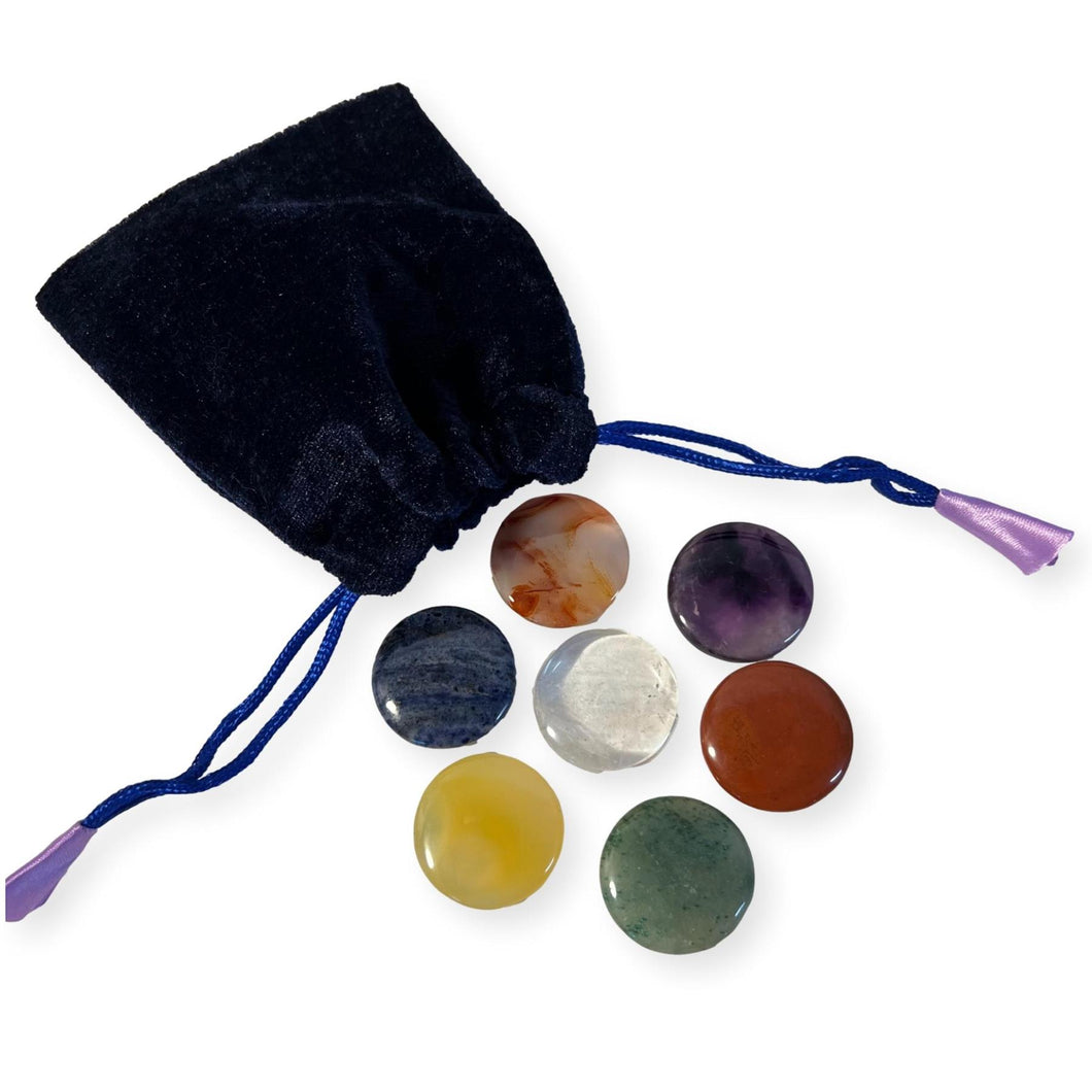Set of 7 Chakra Discs supplied with a Velvet Bag | Discs include Clear Quartz, Amethyst, Sodalite, Green Aventurine, Yellow Onyx, Carnelian, and Red Jasper.
