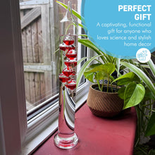 Load image into Gallery viewer, 30cm Tall Free Standing Galileo Thermometer with seven red floating globes | measures temperatures from 16 degrees Centigrade to 28 degrees | also in Fahrenheit | Weather station | Water Thermometer