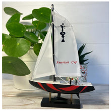Load image into Gallery viewer, Americas Cup Model Yacht  - Black and Red hull | Sailing | Yacht | Boats | Models | Sailing Nautical Gift | Sailing Ornaments | Yacht on Stand | 23cm (H) x 16cm (L) x 3cm (W)