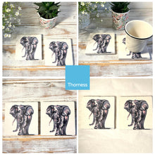 Load image into Gallery viewer, 2 x ELEPHANT STONE COASTERS | Stone Coasters | Animal novelty gift | Coaster for glass, mugs and cups| Square coaster for drinks | Elephant gift | Meg Hawkins art | 10cm x 10cm