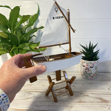 Load image into Gallery viewer, Decorative wooden model sailboat Optimist | 30cm (w) x 45cm (h) x 13.5cm (d) | Fully assembled model |Hand-painted and handmade from wood.