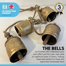 Load image into Gallery viewer, 4 LARGE COW BELLS Distressed Gold hanging on a Rustic Rope | Cow Bells | Bells | Ornamental Bells | Decorative Bells | Rustic Bells | Christmas Bells | Decorations | Home decor