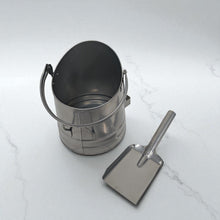 Load image into Gallery viewer, 𝗪𝗔𝗧𝗘𝗥𝗟𝗢𝗢 𝗦𝗧𝗬𝗟𝗘 𝗦𝗜𝗟𝗩𝗘𝗥 𝗙𝗜𝗡𝗜𝗦𝗛 𝗖𝗢𝗔𝗟 & 𝗔𝗦𝗛 𝗕𝗨𝗖𝗞𝗘𝗧 𝗪𝗜𝗧𝗛 𝗦𝗛𝗢𝗩𝗘𝗟 | H29cm x W22cm x D25cm | Heat-Resistant Metal Bucket for Fireplace | Log Burner or Stove | 𝗙𝗜𝗥𝗘𝗦𝗜𝗗𝗘 Accessory for Ash, Coal & Log Storage