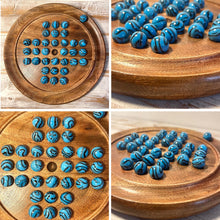 Load image into Gallery viewer, 22cm Diameter wooden SOLITAIRE BOARD GAME with BRILLIANT BLUE BRONTOSAURUS SWIRL GLASS MARBLES | classic wooden solitaire game | strategy board game | family board game | games for one | board games