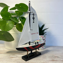 Load image into Gallery viewer, Americas Cup Model Yacht  - Black and Red hull | Sailing | Yacht | Boats | Models | Sailing Nautical Gift | Sailing Ornaments | Yacht on Stand | 23cm (H) x 16cm (L) x 3cm (W)