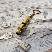 Load image into Gallery viewer, LOUD BRASS WHISTLE on keyring | emergency survival whistle | One piece | Outdoor survival whistle | supplied on Key-Chain or Hang Around Your Neck and Carry it Anywhere