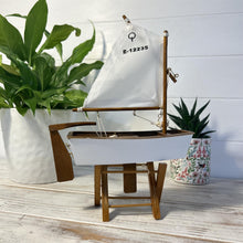 Load image into Gallery viewer, Decorative wooden model sailboat Optimist | 30cm (w) x 45cm (h) x 13.5cm (d) | Fully assembled model |Hand-painted and handmade from wood.