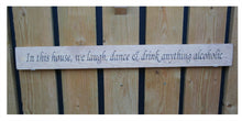 Load image into Gallery viewer, British handmade wooden sign In this house, We laugh, dance and drink anything alcoholic
