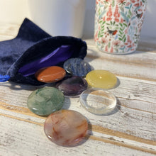 Load image into Gallery viewer, Set of 7 Chakra Discs supplied with a Velvet Bag | Discs include Clear Quartz, Amethyst, Sodalite, Green Aventurine, Yellow Onyx, Carnelian, and Red Jasper.
