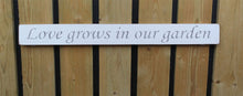 Load image into Gallery viewer, British handmade wooden sign Love grows in the garden
