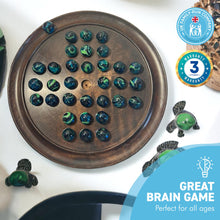 Load image into Gallery viewer, 30cm Diameter WOODEN SOLITAIRE BOARD GAME with SEA TURTLE GLASS MARBLES | classic wooden solitaire game | strategy board game | family board game | games for one | board games