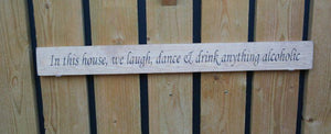 British handmade wooden sign In this house, We laugh, dance and drink anything alcoholic