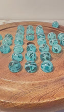 Load and play video in Gallery viewer, 22cm Diameter wooden SOLITAIRE BOARD GAME with BRILLIANT BLUE OXYGEN GLASS MARBLES | classic wooden solitaire game | strategy board game | family board game | games for one | board games