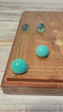 Load and play video in Gallery viewer, Nine Mans Morris marble game with wooden board | Quirky strategy solitaire marble game | includes 20 glass marbles and wooden board | 14cm x 14cm | Mill Game | Traditional wooden game