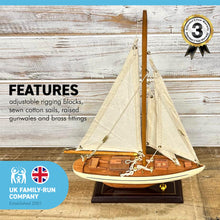 Load image into Gallery viewer, Detailed wooden assembled display model of an Americas Cup Racing Yacht with cream hull | ready for display | adjustable rigging blocks sewn cotton sails | length 25cm height 35cm
