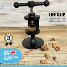 Load image into Gallery viewer, Cast Iron nutcracker | Made from quality heavy Cast Iron with a black finish | practical and sturdy | great ornament and conversation starter | Christmas nut cracker  | Kitchen nutcrackers