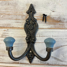 Load image into Gallery viewer, CAST IRON FRENCH STYLE DOUBLE ORNATE HOOKS | Duck Egg Blue Ceramic Ball Tops | Cloakroom Hook | Decorative Double Hook, hat and coat hook | 15cm x 11cm.
