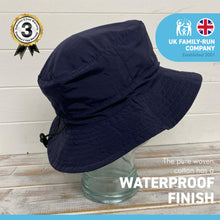 Load image into Gallery viewer, NAVY BLUE 60cm SHOWERPROOF BRIMMED TRILBY BUCKET STYLE HAT | Water-Repellent Bucket style Hat | 100% cotton | lightweight and breathable |foldable | Elasticated toggle for adjustable size