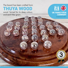 Load image into Gallery viewer, Wooden solitaire board game with pearlescent glass marbles Thuya wood | classic wooden solitaire game