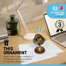 Load image into Gallery viewer, ARMILLARY SPHERE PAPERWEIGHT | NAUTICAL ORNAMENTAL PAPER WEIGHT | 13cm high | Revolving centre | Nautical gifts for desk | Machined brass mounted on hardwood |mantelpiece ornament