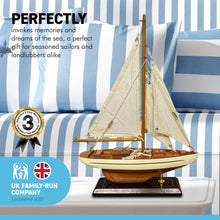 Load image into Gallery viewer, Detailed wooden assembled display model of an Americas Cup Racing Yacht with cream hull | ready for display | adjustable rigging blocks sewn cotton sails | length 25cm height 35cm