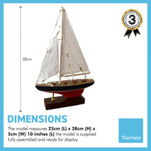 Load image into Gallery viewer, Illuminated detailed wooden assembled display model of a J Class style Yacht | LED lights along the mast and sails | ready for display | adjustable rigging blocks sewn cotton sails | length 25cm height 36cm