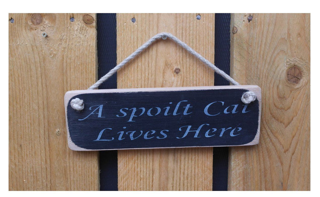 British handmade A Spoilt Cat Lives Here solid wooden hanging sign