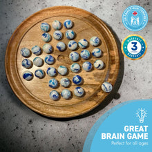 Load image into Gallery viewer, 30cm Diameter WOODEN SOLITAIRE BOARD GAME with JELLYFISH GLASS MARBLES | classic wooden solitaire game | strategy board game | family board game | games for one | board games
