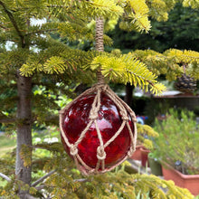 Load image into Gallery viewer, DEEP RED GLASS FISHING FLOAT ORNAMENTAL SEA BUOY | hand blown | nautical seafaring fishing rustic décor | 10cm diameter | with rustic brown string netting and hanging loop | Japanese style glass fishing floats
