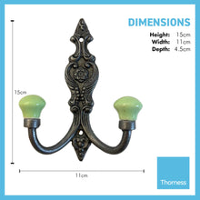 Load image into Gallery viewer, SET OF 2 CAST IRON FRENCH STYLE DOUBLE ORNATE HOOKS | Lime green Ceramic Ball Tops | Cloakroom Hook | Decorative Double Hook, hat and coat hook | 15cm x 11cm.
