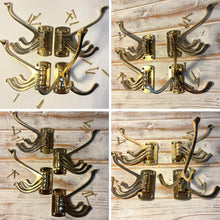 Load image into Gallery viewer, Set of four Polished Brass 𝟯-𝗣𝗥𝗢𝗡𝗚 𝗦𝗪𝗜𝗩𝗘𝗟 𝗖𝗢𝗔𝗧 𝗛𝗢𝗢𝗞𝗦,  Folding Wall Mount Hanger with Screws Included
