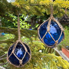 Load image into Gallery viewer, TWO DEEP BLUE GLASS FISHING FLOAT ORNAMENTAL SEA BUOY | hand blown | nautical seafaring fishing rustic décor | 10cm diameter | with rustic brown string netting and hanging loop | Japanese style glass fishing floats
