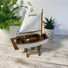 Load image into Gallery viewer, Decorative wooden model sailboat Optimist | 30cm (w) x 45cm (h) x 13.5cm (d) | Fully assembled model |Hand-painted and handmade from wood.
