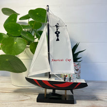 Load image into Gallery viewer, Americas Cup Model Yacht  - Black and Red hull | Sailing | Yacht | Boats | Models | Sailing Nautical Gift | Sailing Ornaments | Yacht on Stand | 23cm (H) x 16cm (L) x 3cm (W)
