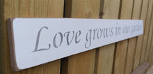 Load image into Gallery viewer, British handmade wooden sign Love grows in the garden
