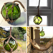 Load image into Gallery viewer, DEEP GREEN GLASS FISHING FLOAT ORNAMENTAL SEA BUOY | hand blown | nautical seafaring fishing rustic décor | 10cm diameter | with rustic brown string netting and hanging loop
