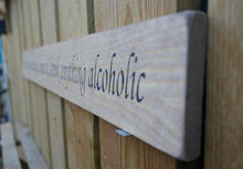Load image into Gallery viewer, British handmade wooden sign In this house, We laugh, dance and drink anything alcoholic
