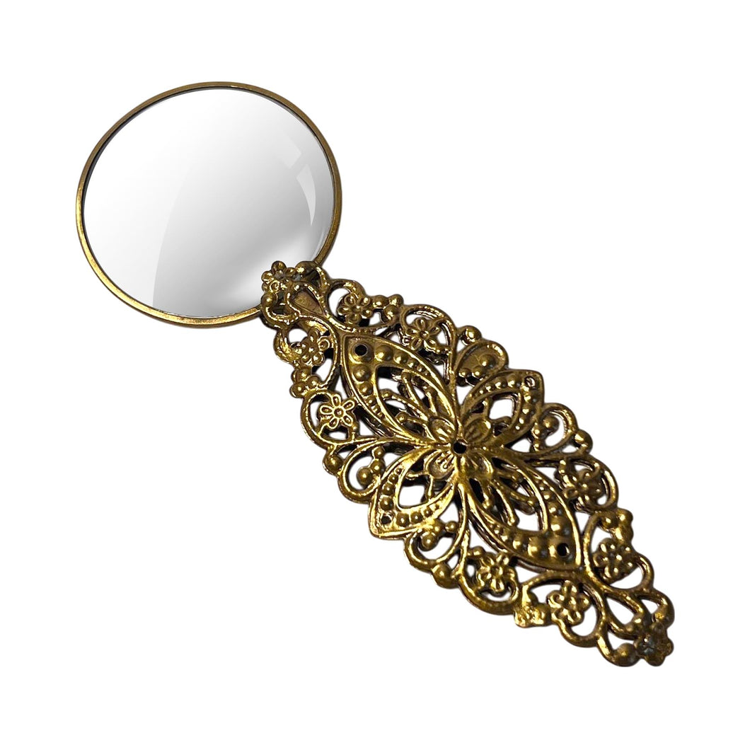 Petite Magnifying Glass with gold handle in leaf pattern, ideal for reading, precision work, crafting.