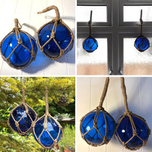 Load image into Gallery viewer, TWO DEEP BLUE GLASS FISHING FLOAT ORNAMENTAL SEA BUOY | hand blown | nautical seafaring fishing rustic décor | 10cm diameter | with rustic brown string netting and hanging loop | Japanese style glass fishing floats
