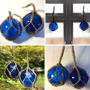 TWO DEEP BLUE GLASS FISHING FLOAT ORNAMENTAL SEA BUOY | hand blown | nautical seafaring fishing rustic décor | 10cm diameter | with rustic brown string netting and hanging loop | Japanese style glass fishing floats