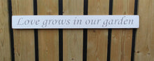 Load image into Gallery viewer, British handmade wooden sign Love grows in the garden
