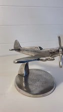 Load and play video in Gallery viewer, Distressed Silver Aluminum Spitfire Model Plane on Stand – Vintage Aircraft Decor Collectible
