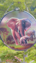 Load and play video in Gallery viewer, Elephant Family Glass Suncatcher, 15cm diameter Decorative Window Hanging, Vibrant Elephant Design
